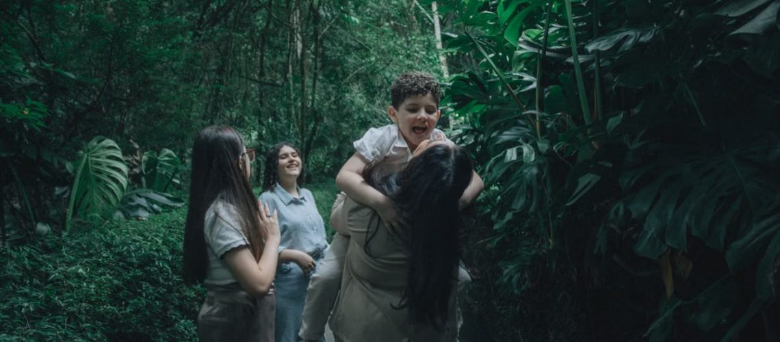 A joyful family bonding in a lush green forest, embracing nature.